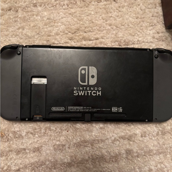 Nintendo Switch with Black Joy-Con, accessories - Picture 5 of 6